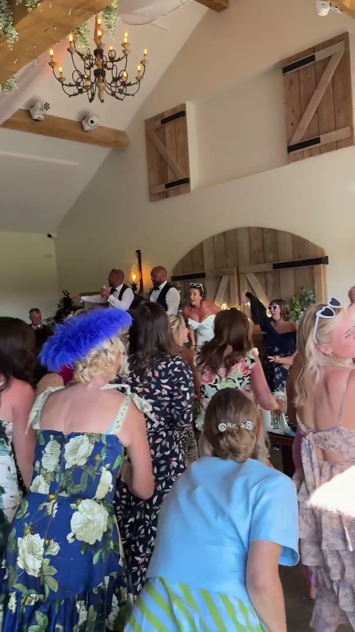 Jon and the wedding crowd dancing together