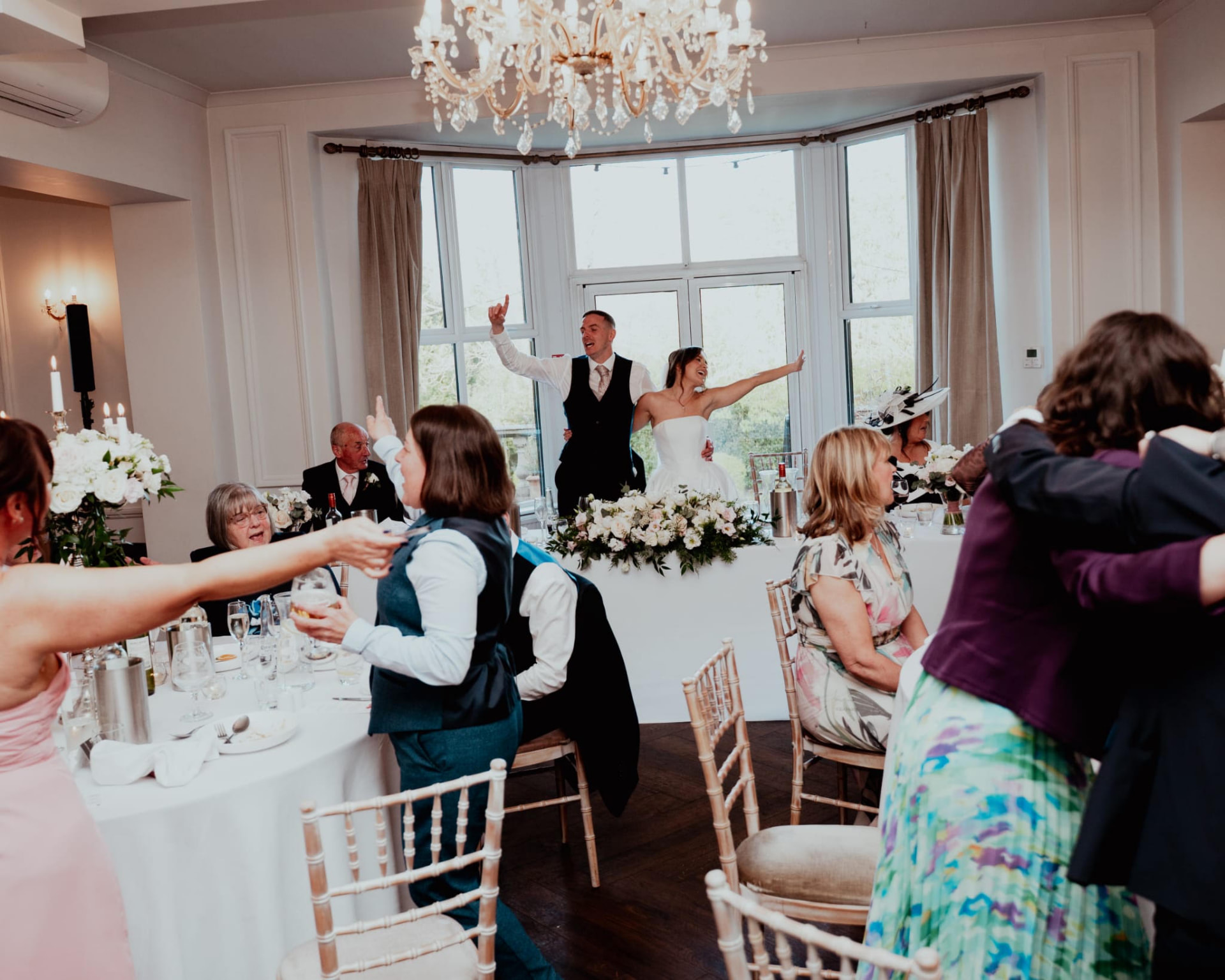 The couple celebrating at the top table