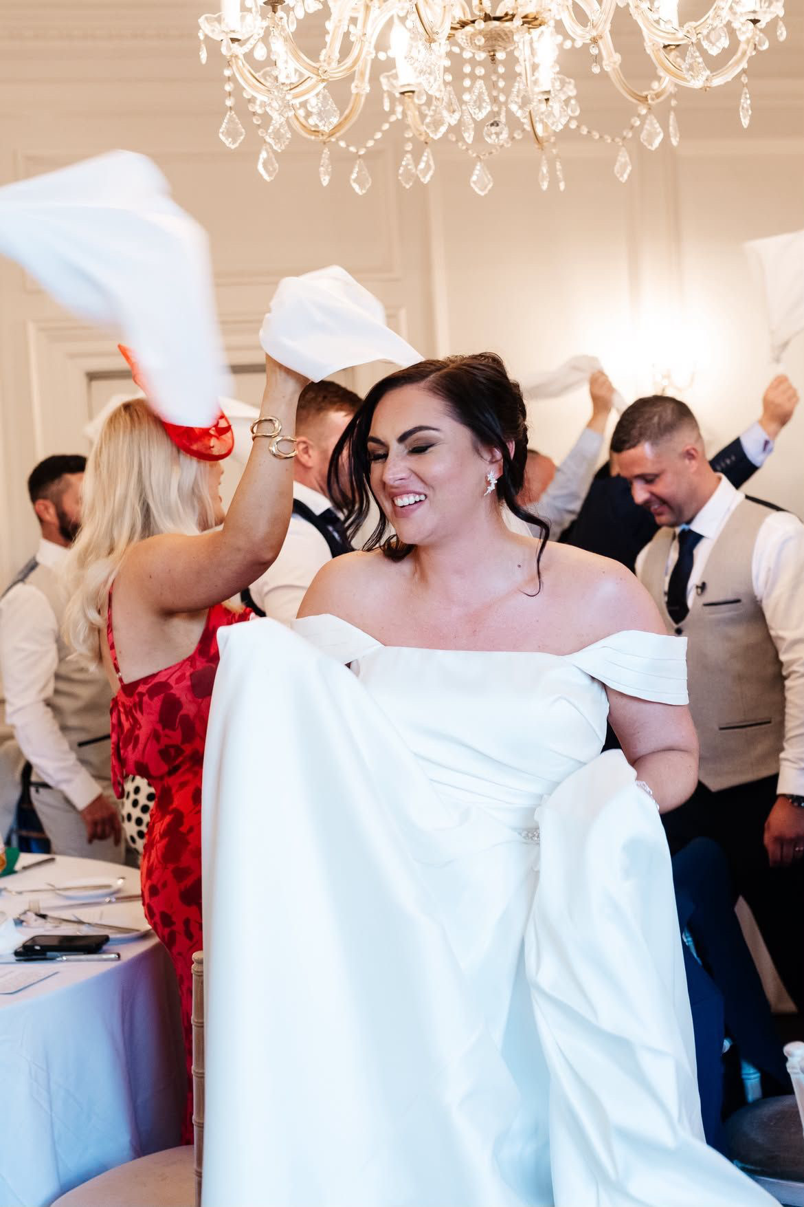 The bride leading the napkin wave